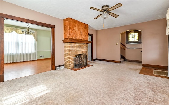151 Jamaica Ave, West View, PA 15229 - unfurnished living room featuring a fireplace, carpet, visible vents, and ceiling fan with notable chandelier