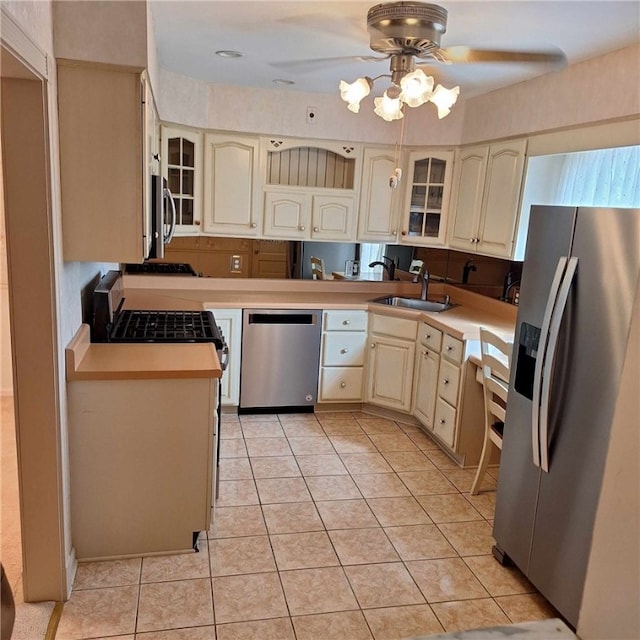 268 Coraopolis Rd, Robinson Twp Nwa, PA 15108 - kitchen featuring stainless steel appliances, a sink, a ceiling fan, and glass insert cabinets