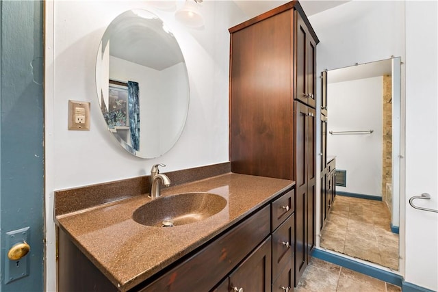bathroom with tile patterned flooring and vanity
