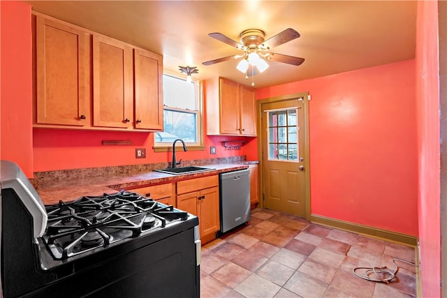 kitchen with stainless steel dishwasher, a wealth of natural light, a ceiling fan, a sink, and black gas range
