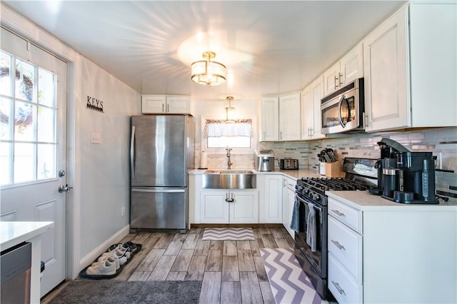 429 Big Knob Rd, New Sewickley Twp, PA 15074 - kitchen with stainless steel appliances, plenty of natural light, light countertops, and a sink