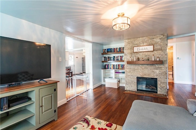 429 Big Knob Rd, New Sewickley Twp, PA 15074 - living area featuring baseboards, a fireplace, and dark wood-style floors