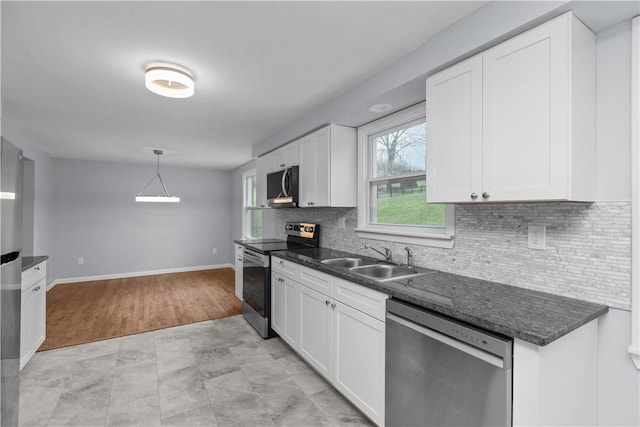 1226 Lamson Cir, Upper St Clair, PA 15241 - kitchen featuring appliances with stainless steel finishes, a sink, white cabinetry, and a healthy amount of sunlight