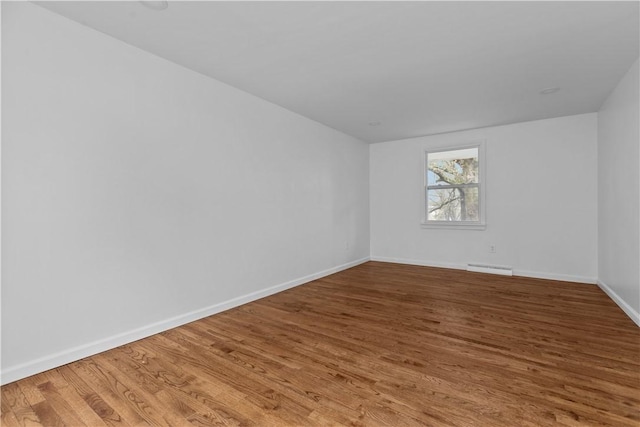 1226 Lamson Cir, Upper St Clair, PA 15241 - empty room with a baseboard radiator, wood finished floors, and baseboards