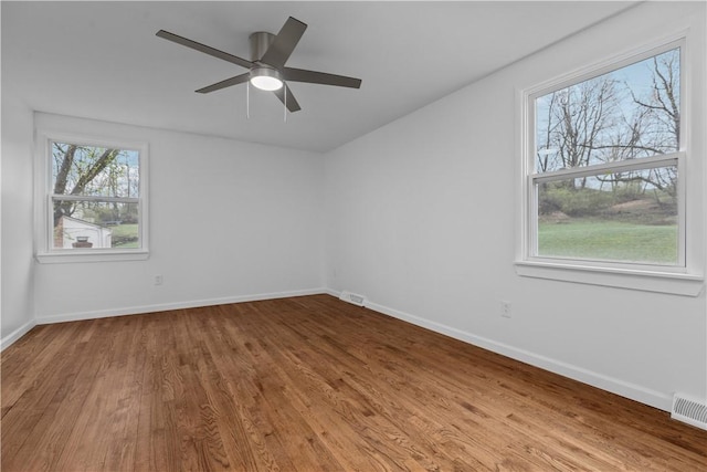 1226 Lamson Cir, Upper St Clair, PA 15241 - spare room featuring visible vents, baseboards, a ceiling fan, and wood finished floors