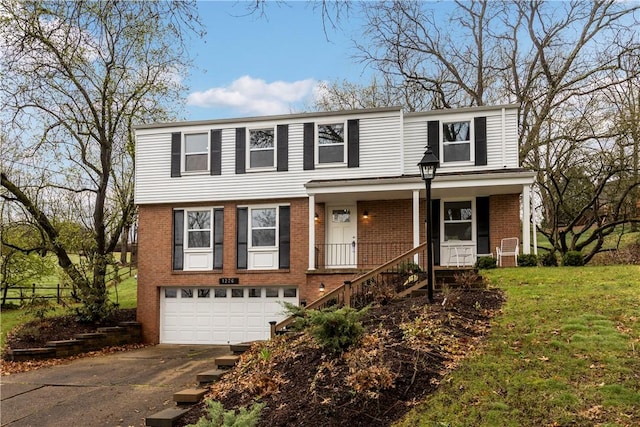1226 Lamson Cir, Upper St Clair, PA 15241 - view of front of house with an attached garage, concrete driveway, a front lawn, and brick siding