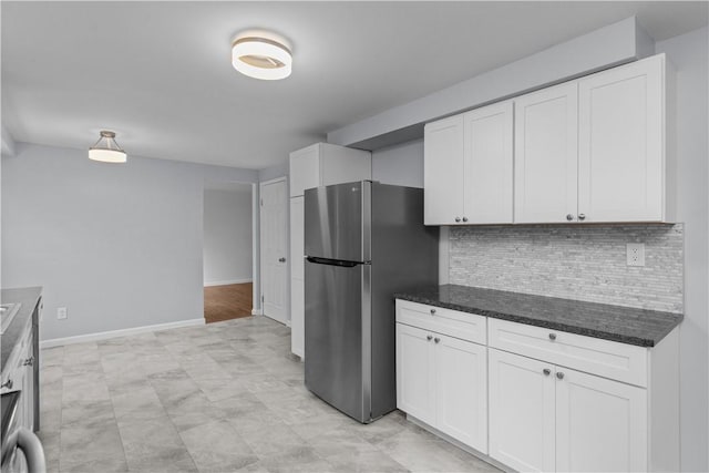 1226 Lamson Cir, Upper St Clair, PA 15241 - kitchen with white cabinets, freestanding refrigerator, and backsplash