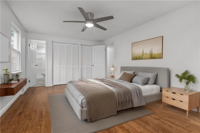 1226 Lamson Cir, Upper St Clair, PA 15241 - bedroom featuring ensuite bathroom, light wood-style flooring, a ceiling fan, and two closets