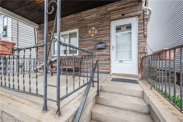 203 57th St, Lawrenceville, PA 15201 - view of exterior entry featuring brick siding