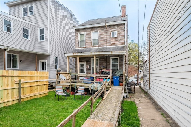 203 57th St, Lawrenceville, PA 15201 - rear view of property featuring a yard and fence