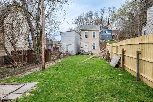 203 57th St, Lawrenceville, PA 15201 - view of yard featuring entry steps and a fenced backyard