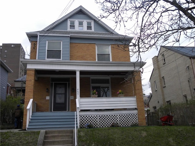 465 S Meadowcroft Ave, Mt Lebanon, PA 15228 - american foursquare style home with covered porch, a front lawn, and brick siding