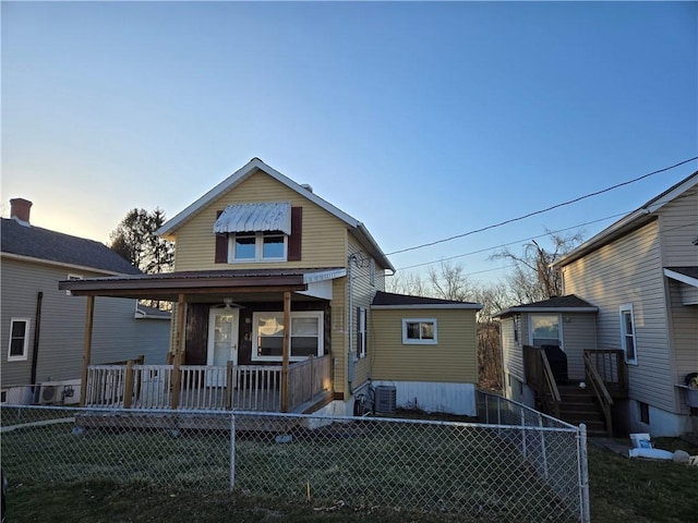335 Main St, Centerville, PA 15358 - view of front facade with a porch, a fenced front yard, and stairway
