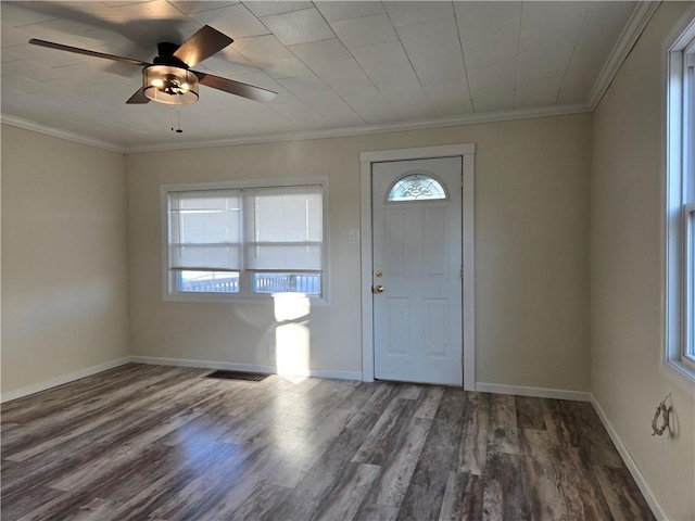 entrance foyer with wood finished floors, ceiling fan, baseboards, and ornamental molding