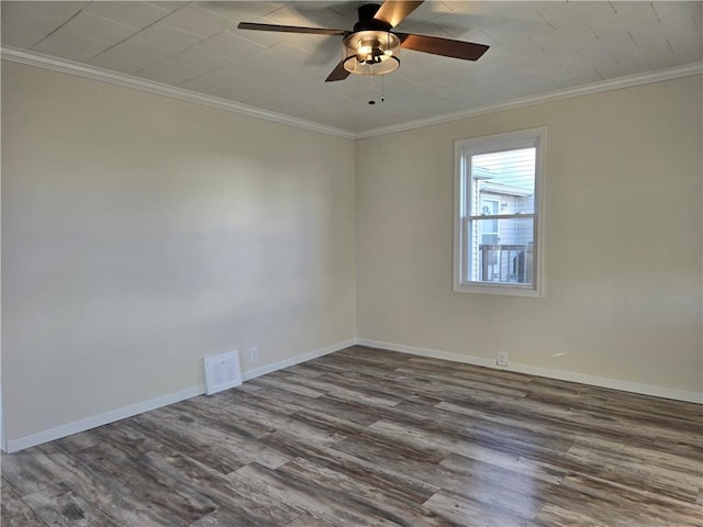 unfurnished room featuring crown molding, ceiling fan, wood finished floors, and baseboards
