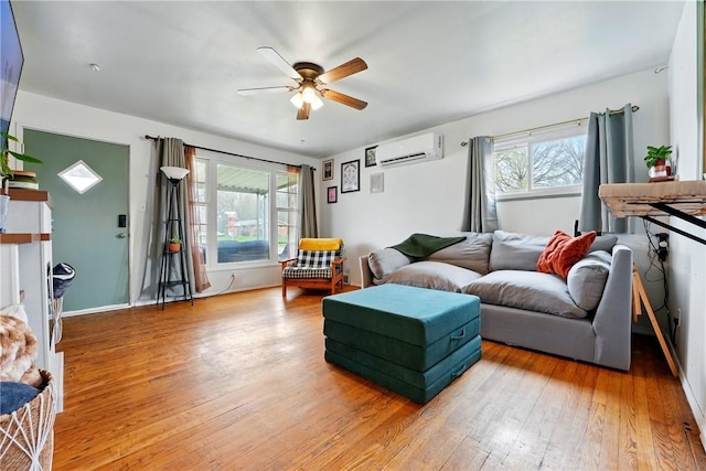 856 Spencer Ave, Sharon, PA 16146 - living room featuring hardwood / wood-style flooring, a wall unit AC, and ceiling fan