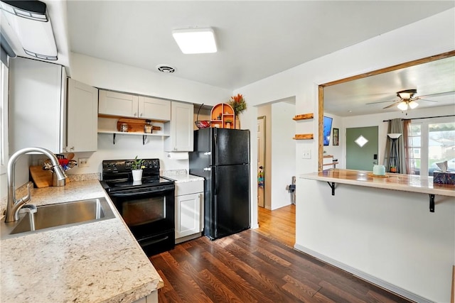 856 Spencer Ave, Sharon, PA 16146 - kitchen featuring visible vents, open shelves, a sink, black appliances, and dark wood-type flooring