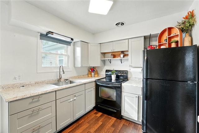 856 Spencer Ave, Sharon, PA 16146 - kitchen with dark wood finished floors, open shelves, visible vents, a sink, and black appliances