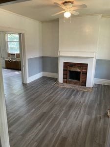 140 Washington Ave, Bellevue, PA 15202 - unfurnished living room with wood finished floors, ceiling fan, baseboards, and a brick fireplace