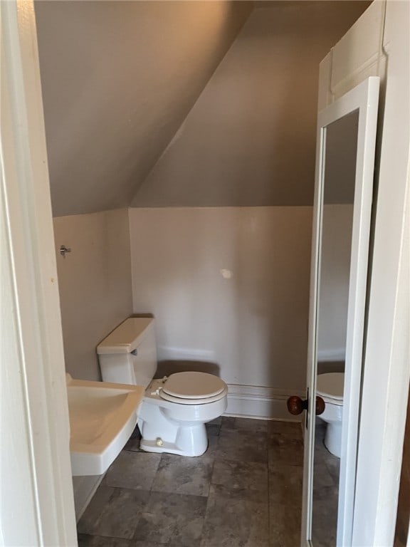 140 Washington Ave, Bellevue, PA 15202 - bathroom with a sink, toilet, and vaulted ceiling