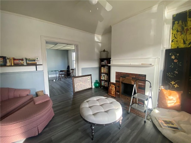 140 Washington Ave, Bellevue, PA 15202 - living area featuring a wainscoted wall, vaulted ceiling, a ceiling fan, wood finished floors, and a fireplace