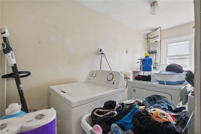 laundry room featuring laundry area and separate washer and dryer