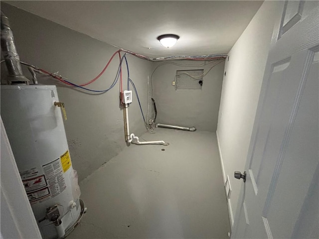 below grade area featuring water heater