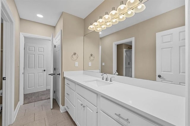 bathroom featuring vanity and baseboards