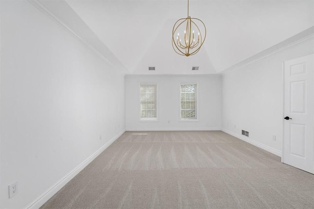 carpeted spare room with a chandelier, baseboards, vaulted ceiling, and visible vents