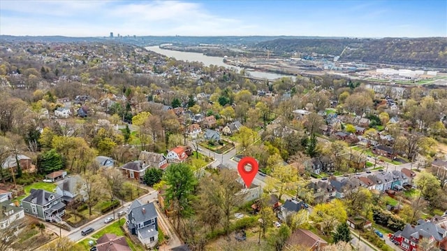 birds eye view of property featuring a residential view and a water view