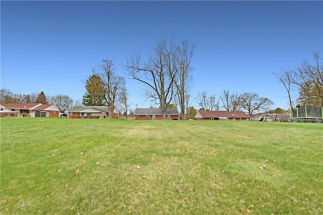 view of yard featuring a trampoline