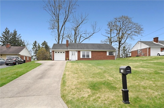 ranch-style house with a front yard, an attached garage, a chimney, brick siding, and driveway