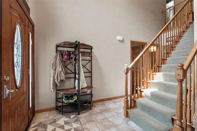 172 Valley Flds, Plum Boro, PA 15239 - foyer with stairway, a towering ceiling, and baseboards