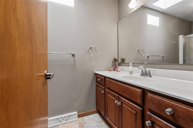 172 Valley Flds, Plum Boro, PA 15239 - bathroom featuring visible vents, baseboards, vanity, a skylight, and tile patterned flooring