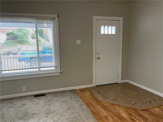 entrance foyer featuring visible vents and baseboards