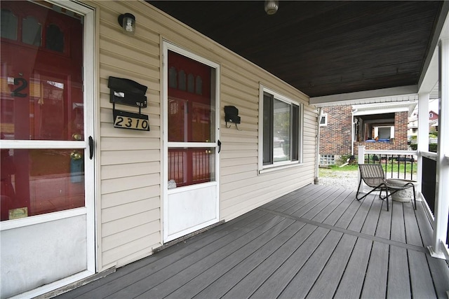 wooden deck featuring covered porch