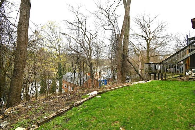view of yard with a wooden deck