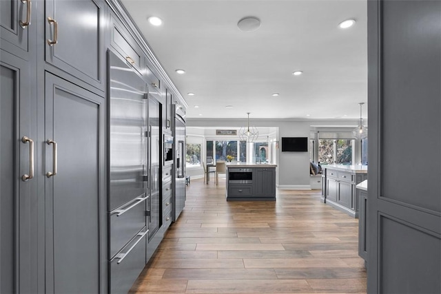 210 Creek Dr, Edgeworth, PA 15143 - kitchen featuring stainless steel appliances, recessed lighting, light wood-style flooring, gray cabinets, and hanging light fixtures
