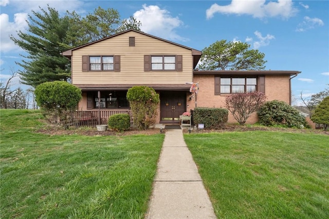 5000 Holly Ct, Murrysville, PA 15668 - view of front facade with a porch, a front lawn, and brick siding