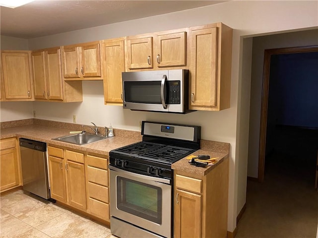 2410 Jane St, South Side, PA 15203 - kitchen with light tile patterned floors, a sink, light countertops, light brown cabinetry, and stainless steel appliances