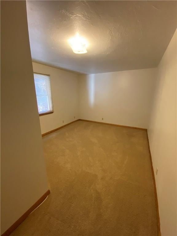 2410 Jane St, South Side, PA 15203 - empty room with light carpet, baseboards, and a textured ceiling