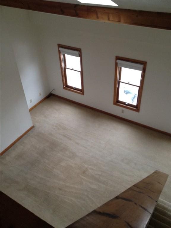 2410 Jane St, South Side, PA 15203 - spare room with beamed ceiling, light colored carpet, and baseboards