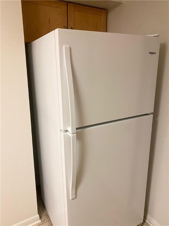2410 Jane St, South Side, PA 15203 - room details featuring baseboards and freestanding refrigerator