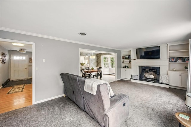 living room featuring crown molding, baseboards, visible vents, and carpet floors