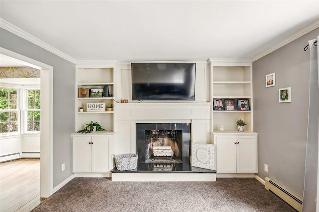 carpeted living area with baseboards, a fireplace with raised hearth, a baseboard heating unit, and crown molding