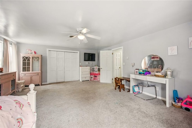 playroom featuring ceiling fan, baseboards, and carpet