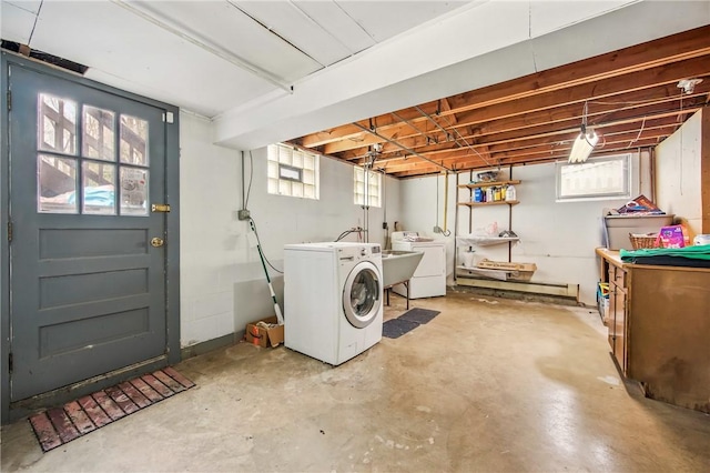 washroom with washing machine and clothes dryer and laundry area