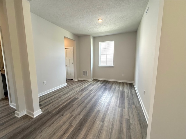 406 Barons Ct, Peters Twp, PA 15367 - unfurnished room with a textured ceiling, dark wood-style floors, and baseboards