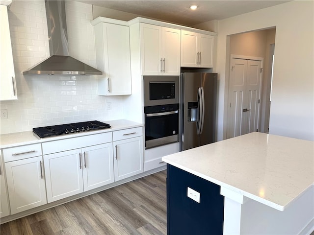 406 Barons Ct, Peters Twp, PA 15367 - kitchen with appliances with stainless steel finishes, wall chimney range hood, white cabinets, light wood-style flooring, and recessed lighting