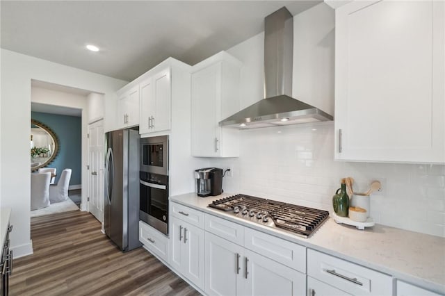 406 Barons Ct, Peters Twp, PA 15367 - kitchen featuring wall chimney range hood, stainless steel appliances, white cabinetry, decorative backsplash, and recessed lighting